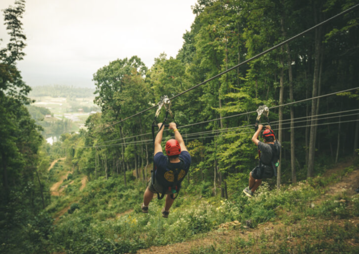 Two People Ziplining