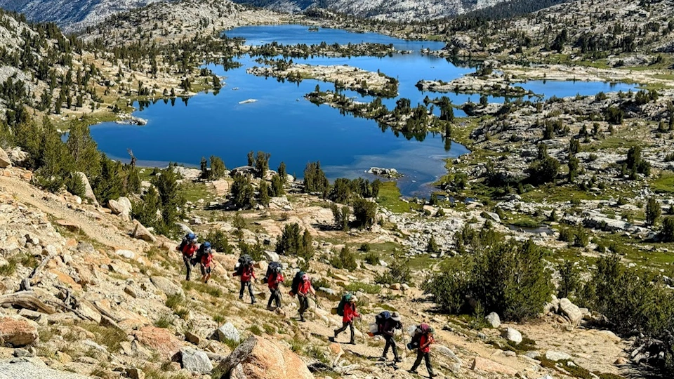 Scouts hiking a trail in the back country